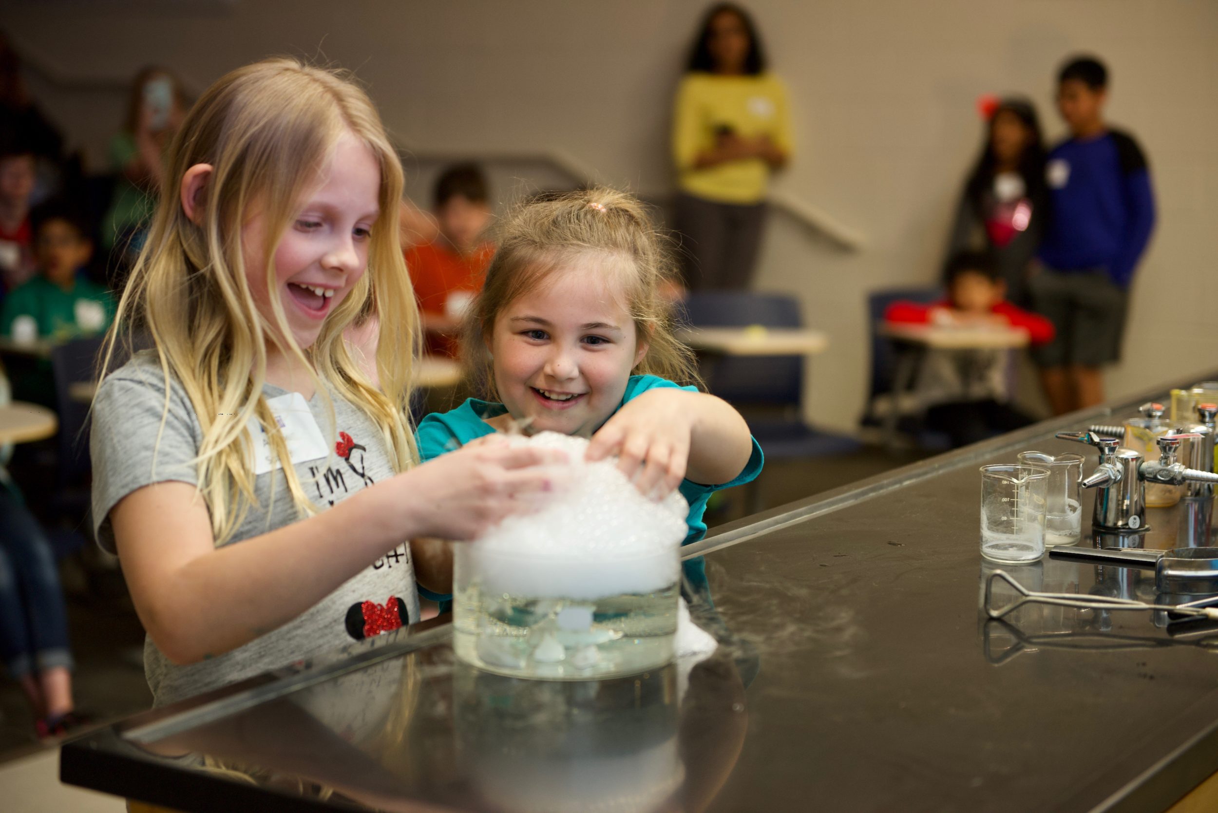 Children doing science experiments with bubbles